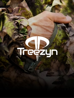 Close-up of a hunter's hand gripping a zipper pull on Treezyn camouflage gear, with the Treezyn logo overlaid in white